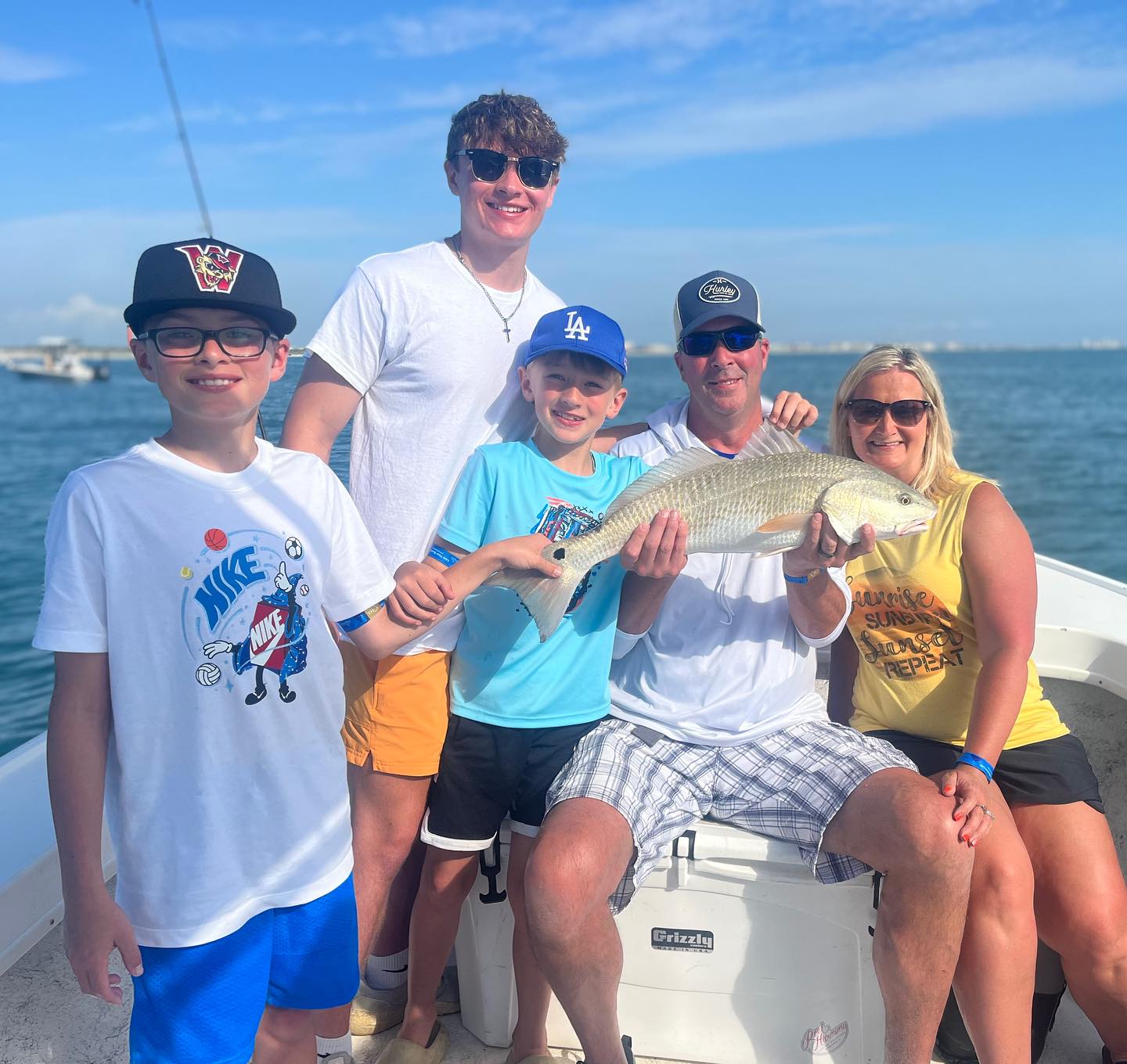 Family with redfish on Yellow Dawg charter