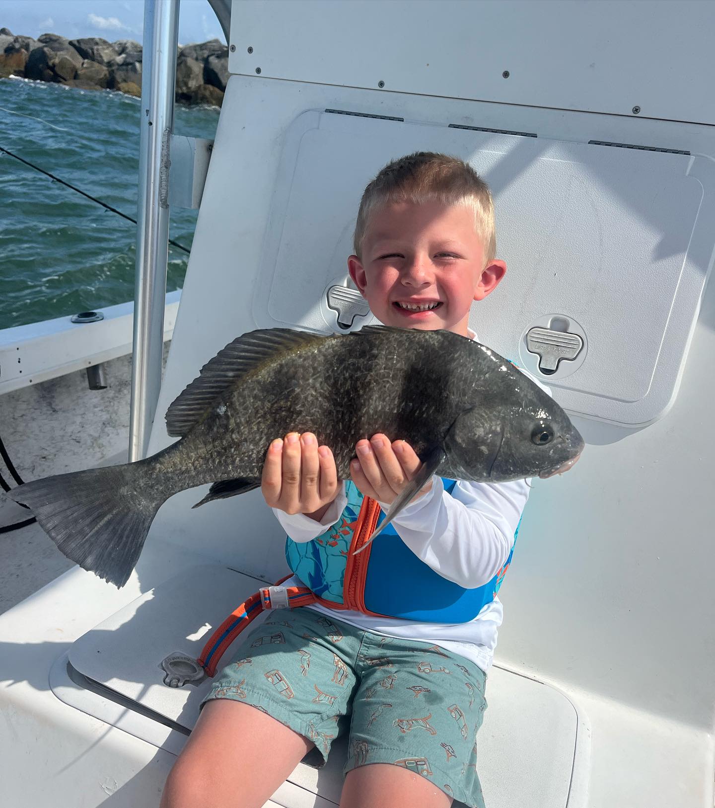 Young angler with sheepshead caught on Yellow Dawg Fishing charter